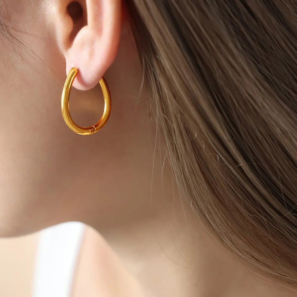 The Aurora Drop Huggie Earrings